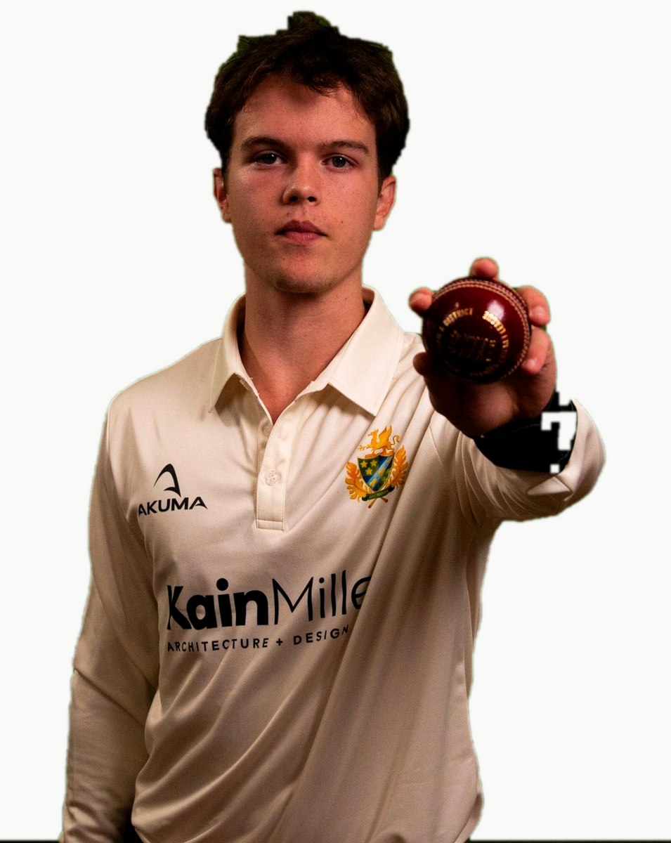 Jacob Drew holding a cricket ball to the camera